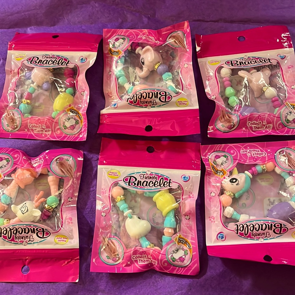 Brand new in unopened packages. Set of 6 different twisty bracelets.
